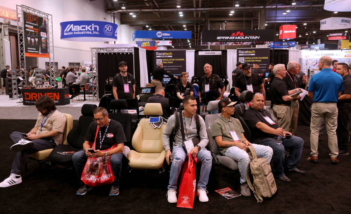 Conventioneers check out performance car seats in the SCAT Enterprises Procar custom seating sy ...