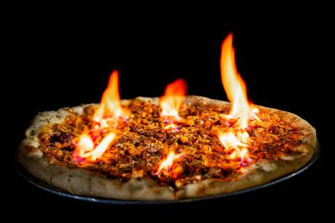 The Reaper pizza from Evel Pie in downtown Las Vegas stretches 20 fiery inches and is made with ...