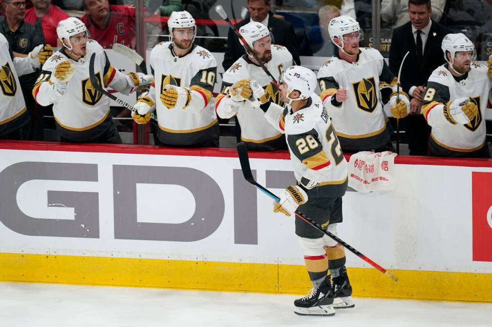 Vegas Golden Knights left wing William Carrier (28) celebrates his goal with teammates in the t ...