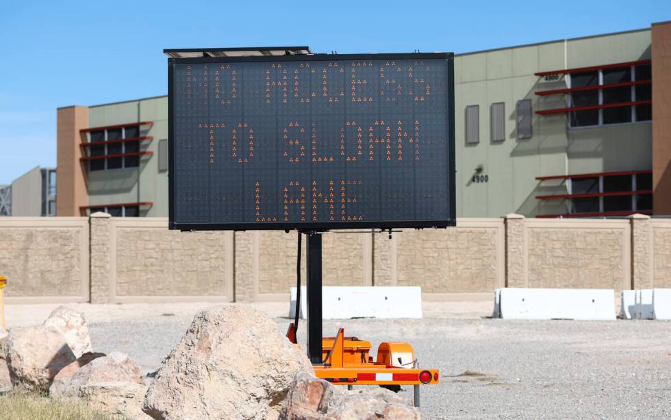 A sign indicates the closure of the intersection of Sloan Lane at North Las Vegas Boulevard, wh ...