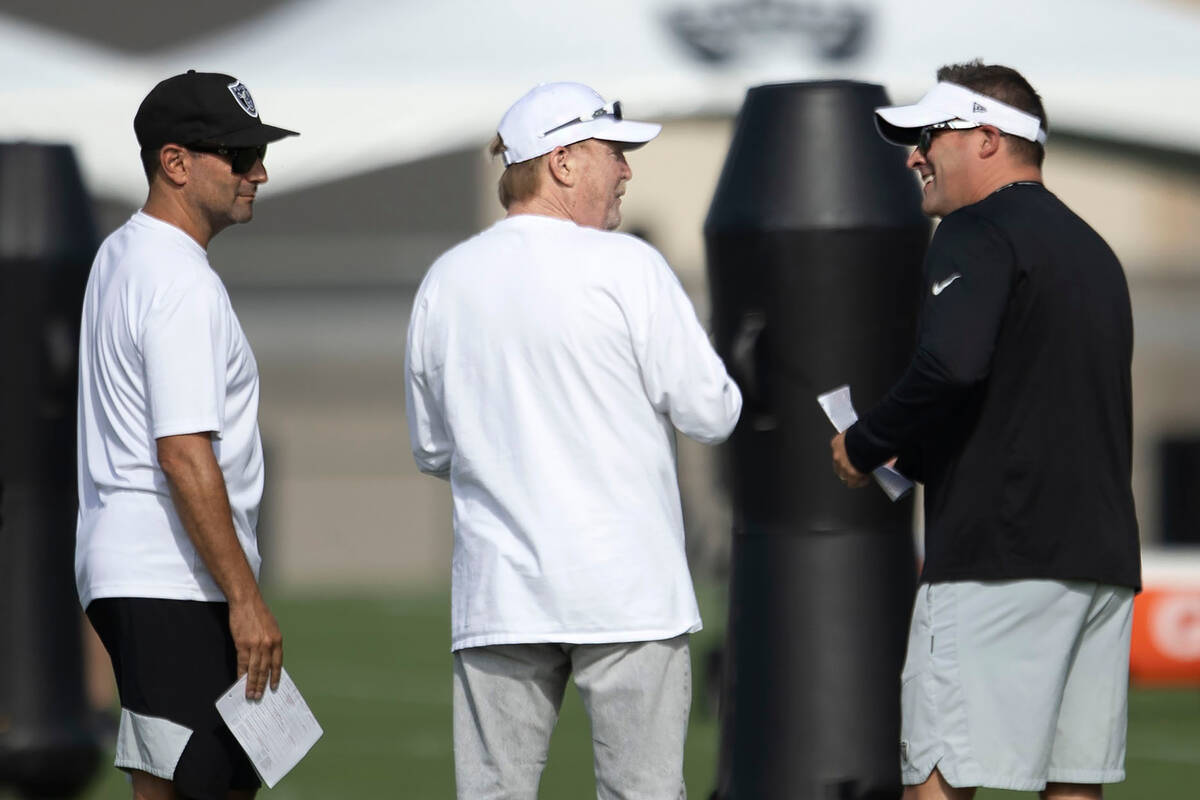 Raiders general manager Dave Ziegler, left, and head coach Josh McDaniels, right, meet with own ...