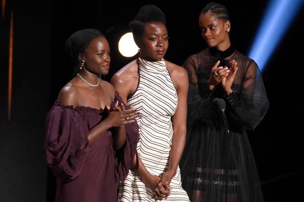 Lupita Nyong'o, from left, Danai Gurira, and Letitia Wright accept the award for outstanding mo ...