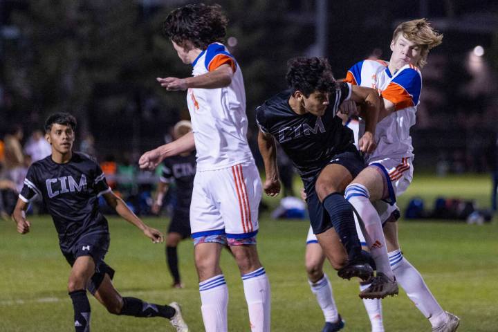 Bishop Gorman and Cimarron players fight for control of the ball during the second half of thei ...