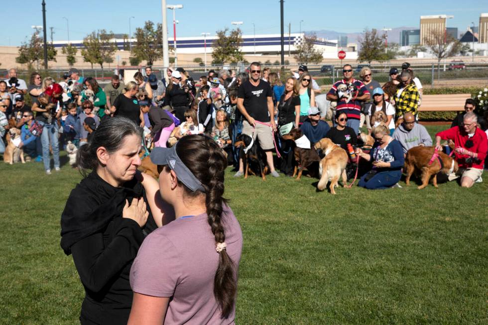 Tina Tintor's aunt speaks with Angela Pinzon, an organizer, during a walk in honor of Tintor an ...