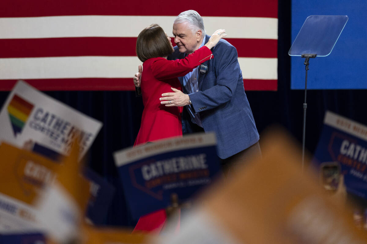 Sen. Catherine Cortez Masto, left, is embraced by Governor Steve Sisolak as she takes the stage ...