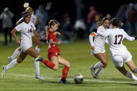 Coronado’s Tia Garr, second from left, winds up to shoot the game-winning goal while Des ...