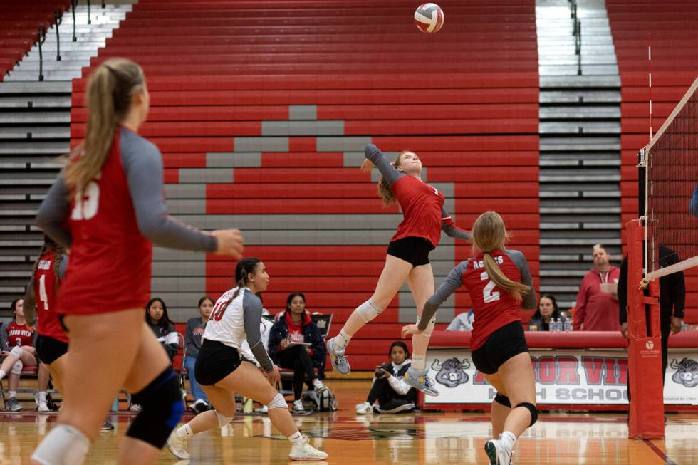 Arbor View’s Madison Garvin, center right, spikes to Basic during a Class 4A girls state ...