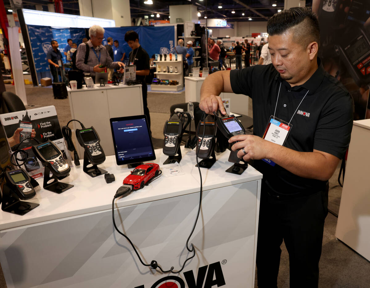 Jason Rabuy of Innova Electronics in Irvine, Calif. shows a diagnostic tool on Day 2 of the Spe ...