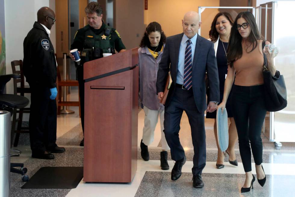 Assistant State Attorney Mike Satz, center, walks into court along with family members of the v ...