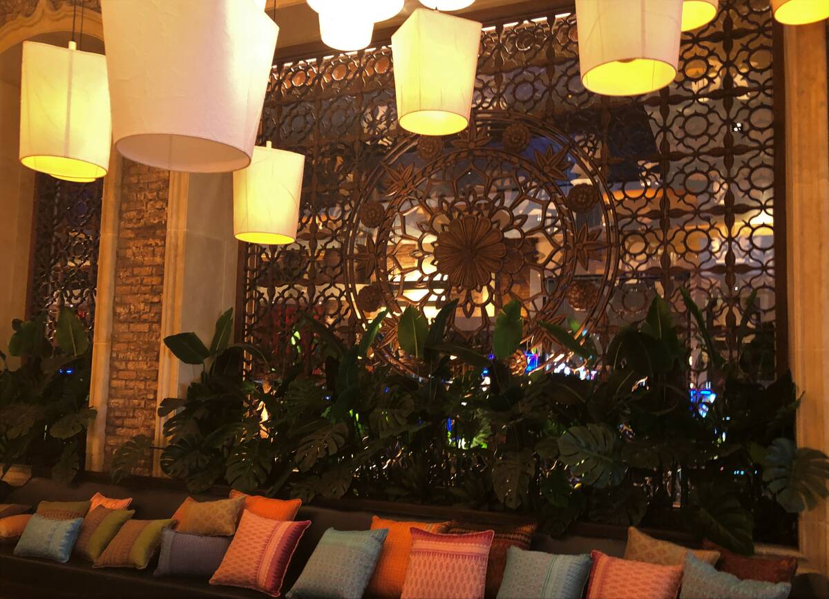 Stone arches enclose carved teak-style screens in the lounge room of the new Lotus of Siam rest ...