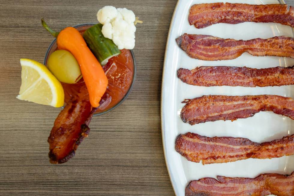 A bacon bloody mary and strips of, well, bacon, from Snooze A.M. Eatery, which is opening its f ...
