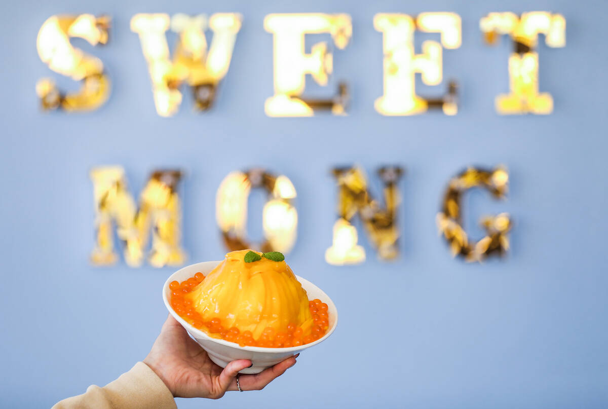 Amy Park, co-owner and manager, holds a mango bingsoo, a Korean shave ice, at Sweet Mong in Las ...
