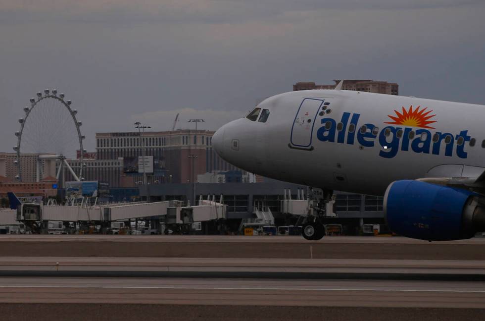 An Allegiant Air plane lands at Harry Reid International Airport on Tuesday, July 26, 2022, in ...