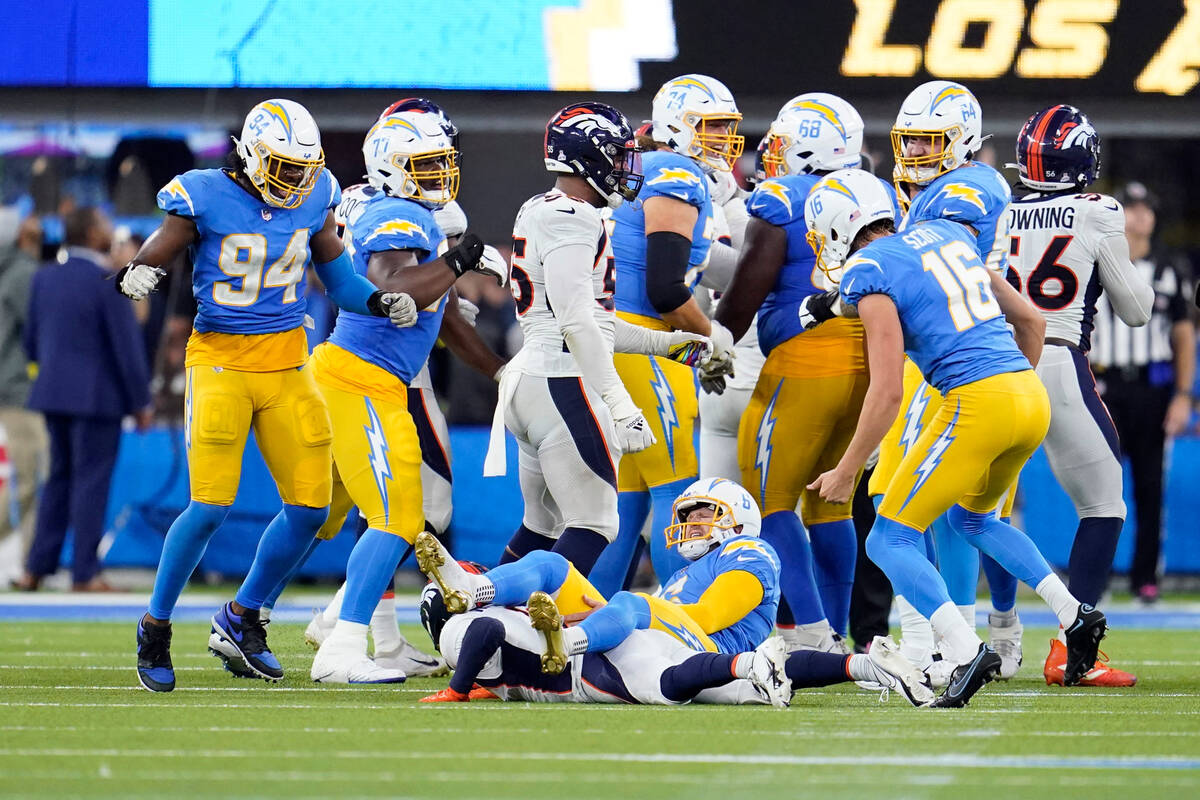 Los Angeles Chargers place kicker Dustin Hopkins (6) lies on the ground after making the game-w ...