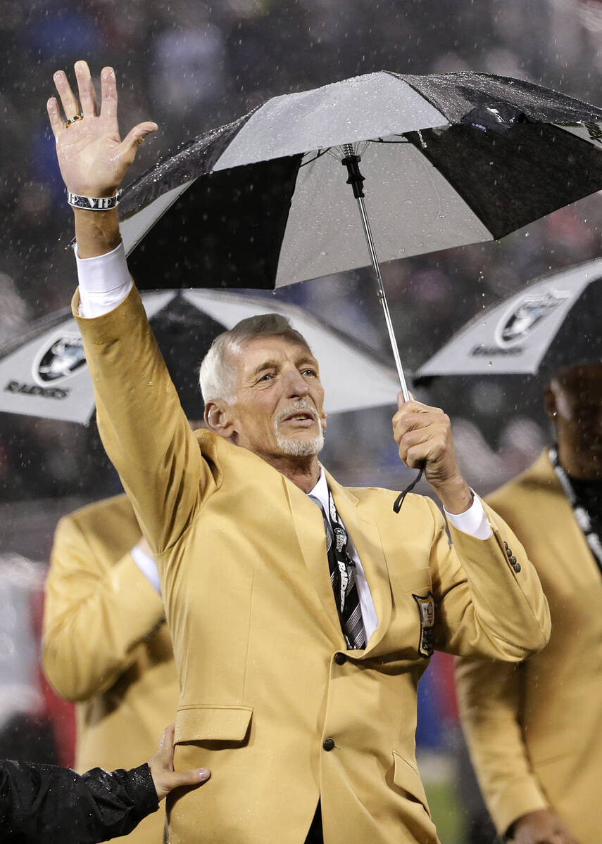 Former Oakland Raiders punter Ray Guy waves during a ceremony honoring his induction into the p ...