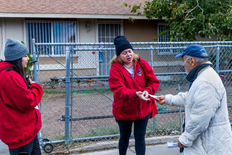 Mirian Cervantes, center, and her daughter Arlett Tovar, left, with the Culinary Union, talk ab ...