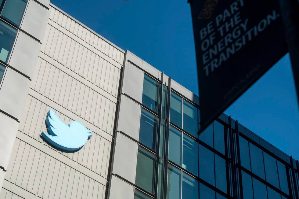 A Twitter logo hangs outside the company's San Francisco offices on Tuesday, Nov. 1, 2022. Empl ...