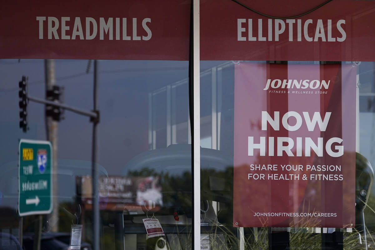 Hiring sign are displayed in Northbrook, Ill., Wednesday, Sept. 21, 2022. (AP Photo/Nam Y. Huh)