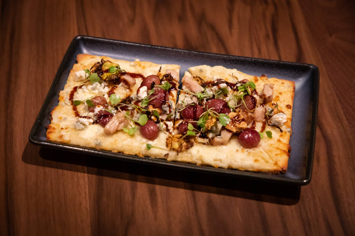 A roasted grape and porkbelly flatbread from a private tasting at chef Gordon Ramsay’s new Ra ...
