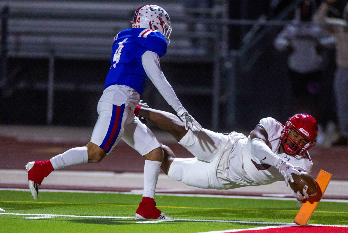 Arbor View RB Richard Washington (2) dives to the end zone on a holding call with Liberty SB Co ...