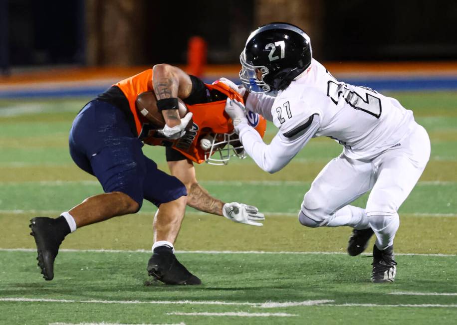 Desert Pines’ RJ Tiggs (27) tackles Bishop Gorman’s Trech Kekahuna (23) during th ...