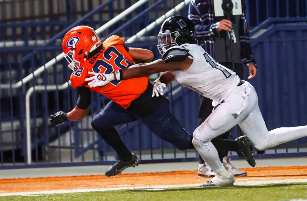 Bishop Gorman’s Micah Kaapana (22) runs the ball to score a touchdown past Desert Pines& ...