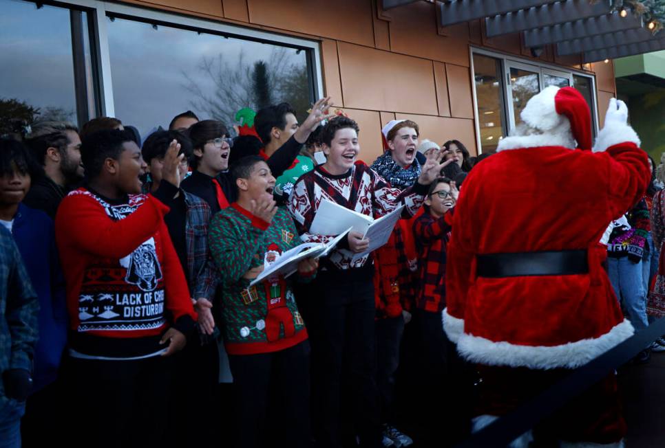 Choirs from Gunderson Middle School and Coronado High School greet Santa during the annual ligh ...