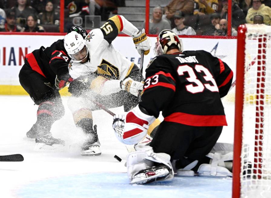 Vegas Golden Knights right wing Keegan Kolesar (55) tries to shoot against Ottawa Senators goal ...