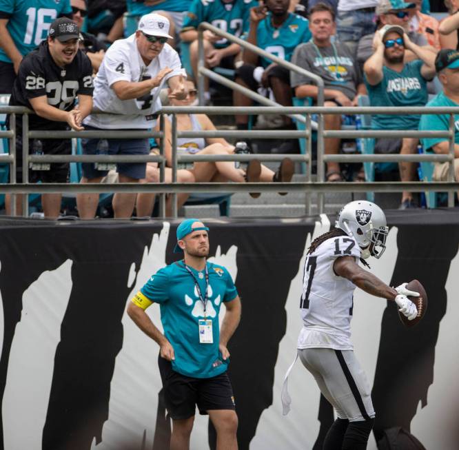 Raiders fans applaud as Raiders wide receiver Davante Adams (17) scores his second touchdown du ...