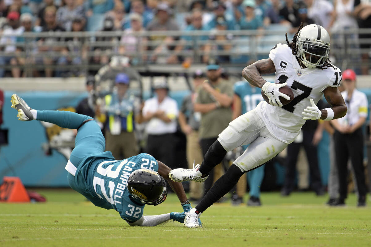 Las Vegas Raiders wide receiver Davante Adams (17) catches a pass in front of Jacksonville Jagu ...