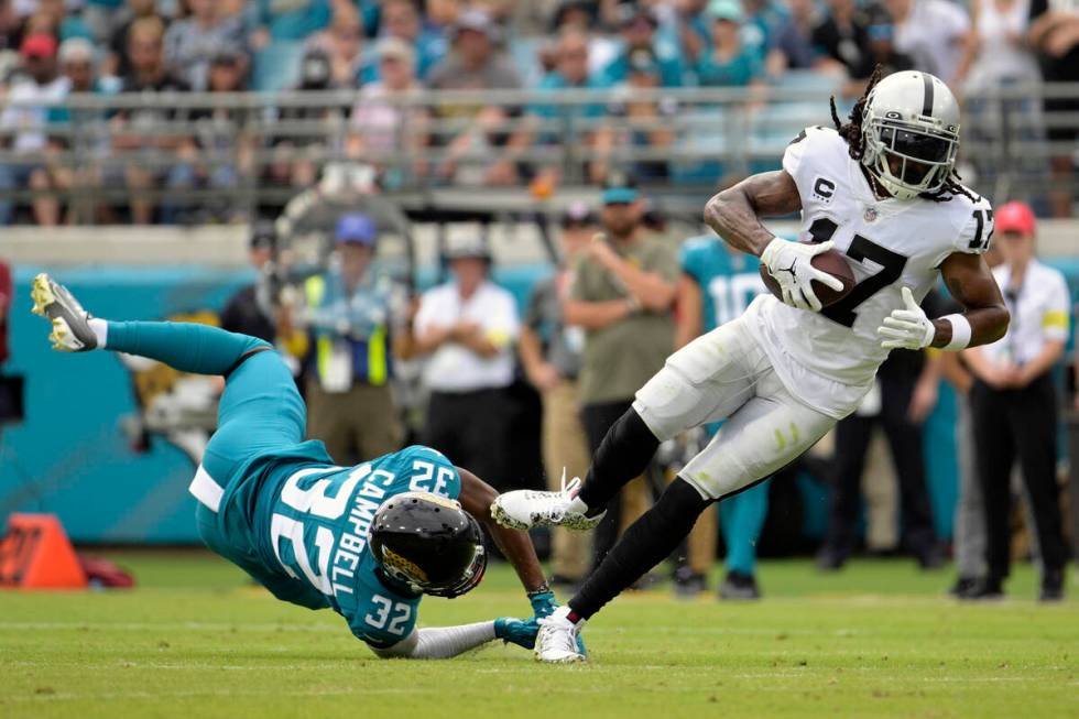 Las Vegas Raiders wide receiver Davante Adams (17) catches a pass in front of Jacksonville Jagu ...