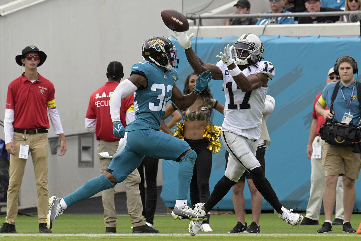 Las Vegas Raiders wide receiver Davante Adams (17) catches a touchdown pass ahead of Jacksonvil ...