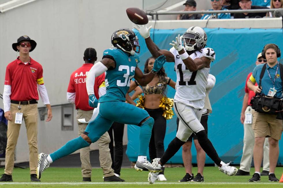 Las Vegas Raiders wide receiver Davante Adams (17) catches a touchdown pass ahead of Jacksonvil ...