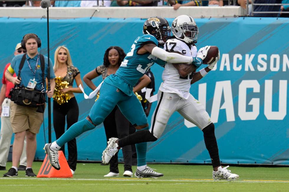 Las Vegas Raiders wide receiver Davante Adams (17) catches a touchdown pass ahead of Jacksonvil ...