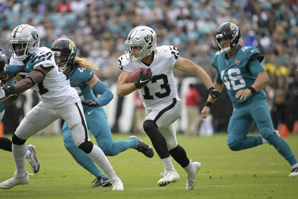 Las Vegas Raiders' Hunter Renfrow (13) returns a punt against the Jacksonville Jaguars in the f ...