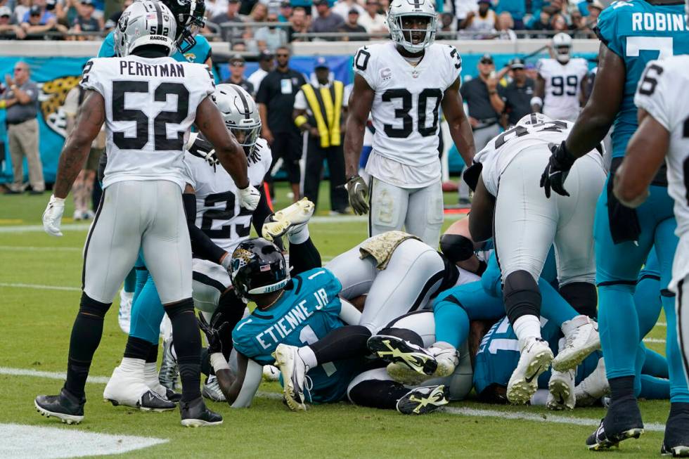 Jacksonville Jaguars running back Travis Etienne Jr. (1) scores a touchdown against the Las Veg ...