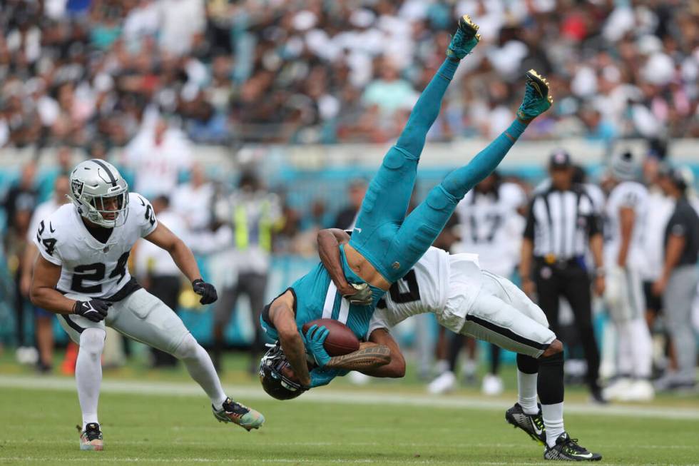 Jacksonville Jaguars wide receiver Marvin Jones Jr. (11) is tackled by catches a pass for a tou ...