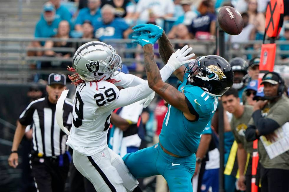 Las Vegas Raiders cornerback Anthony Averett (29) breaks up a pass intended for Jacksonville Ja ...