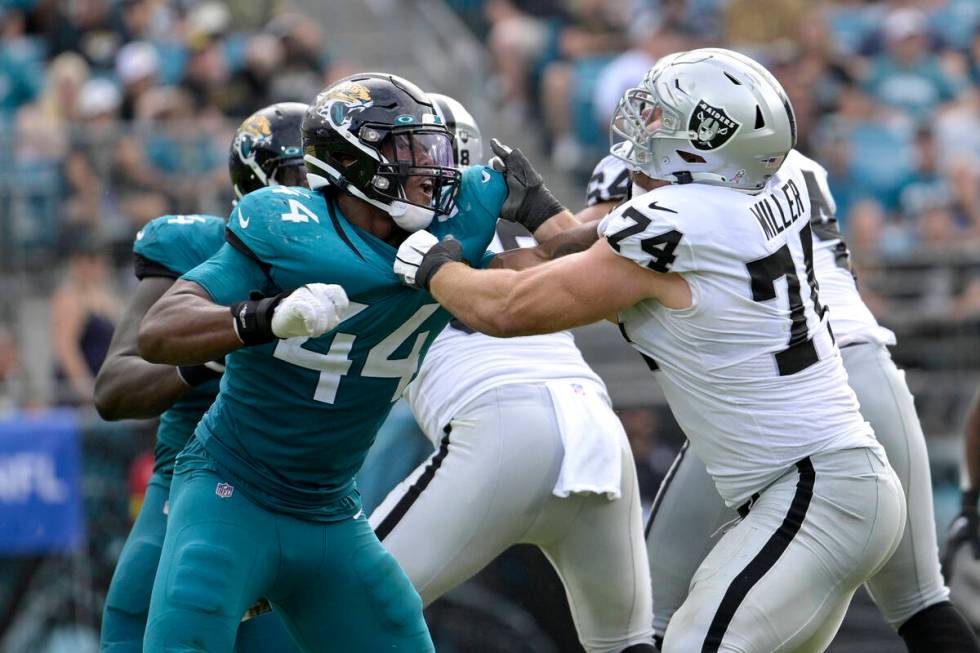 Jacksonville Jaguars linebacker Travon Walker (44) battles Las Vegas Raiders offensive tackle K ...