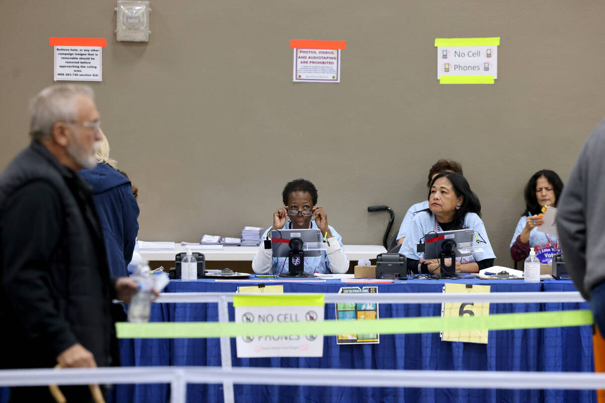 Poll workers waits for voters on Election Day at Desert Breeze Community Center in Las Vegas Tu ...