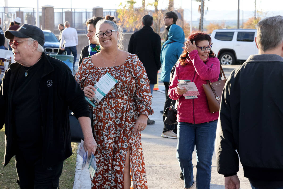 People, including Mary MacDonald of Las Vegas, second from left, line up to vote on Election Da ...