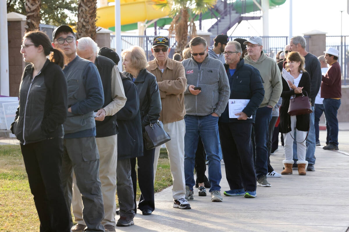 Voters line up to cast their ballots on Election Day at Desert Breeze Community Center in Las V ...