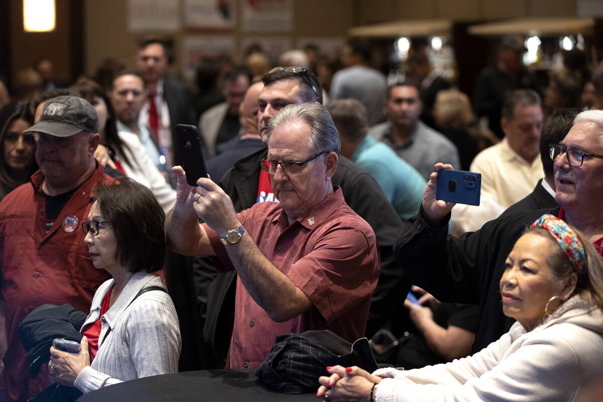 Attendees watch results come in during a GOP midterm election watch party at Red Rock Casino on ...