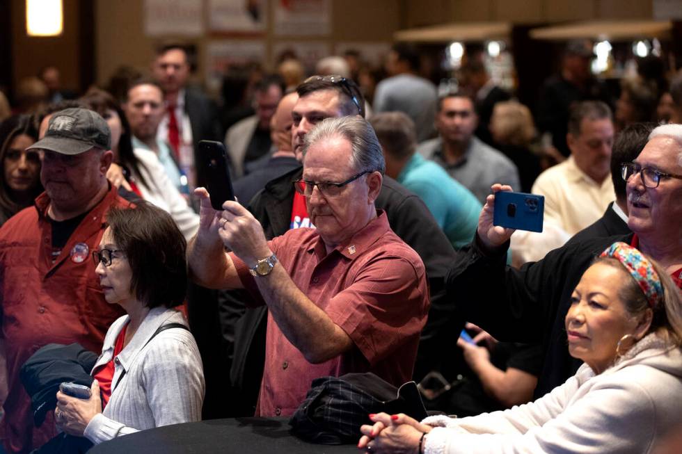 Attendees watch results come in during a GOP midterm election watch party at Red Rock Casino on ...