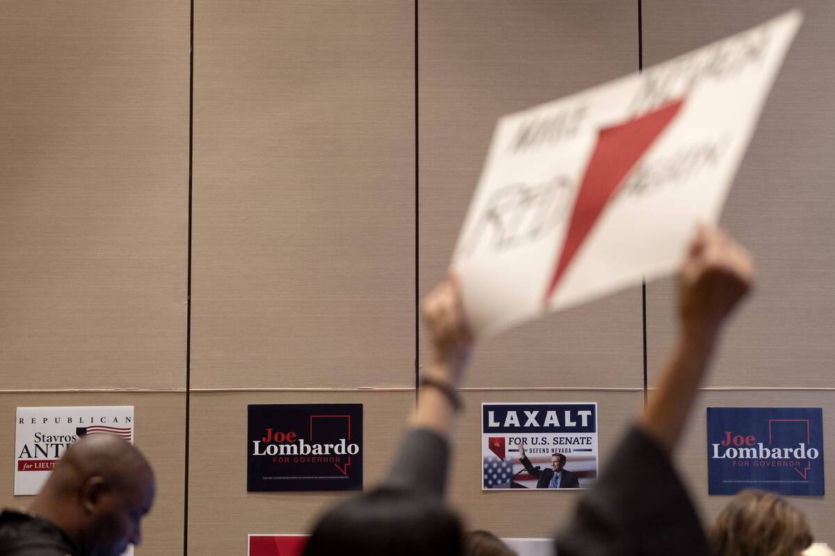 Signs supporting GOP candidates are hung on the walls during a midterm election watch party at ...