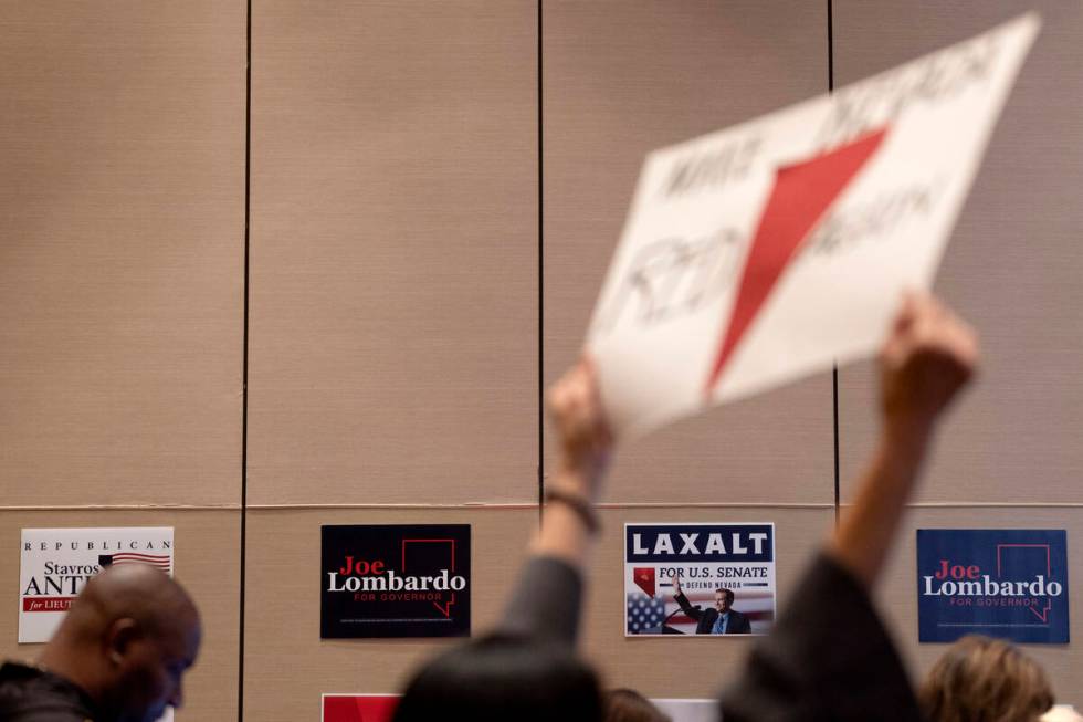 Signs supporting GOP candidates are hung on the walls during a midterm election watch party at ...
