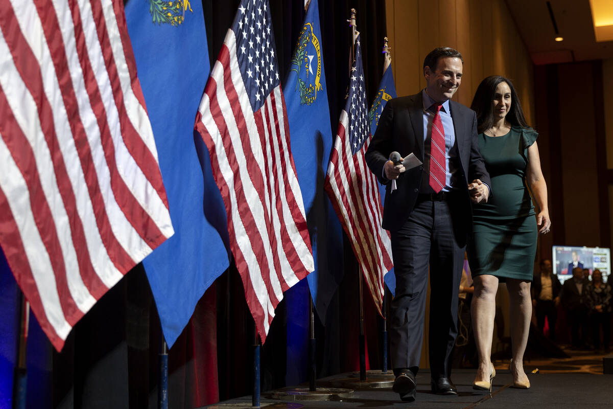 Nevada Republican Senate candidate Senate Adam Laxalt walks on stage with his wife Jaime Laxalt ...