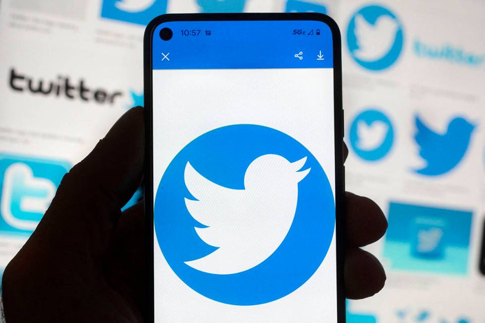 The Twitter logo is seen on a cell phone, Friday, Oct. 14, 2022, in Boston. (AP Photo/Michael D ...