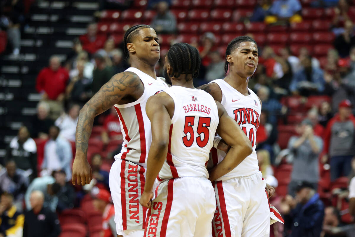 UNLV Rebels guard Luis Rodriguez (15) cepebras his score with guard EJ Harkless (55) and guard ...