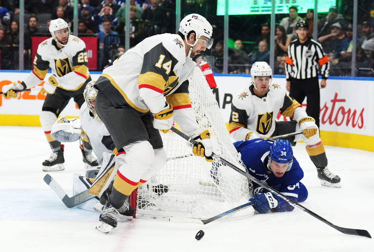 Toronto Maple Leafs forward Auston Matthews (34) tries a wrap around as Vegas Golden Knights de ...